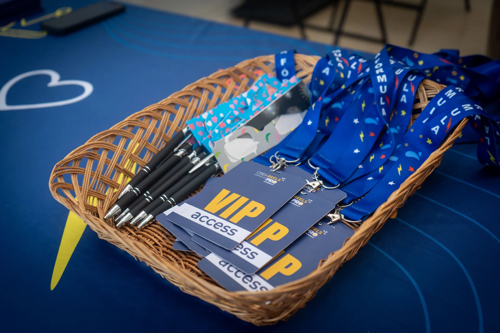 VIP passes and branded lanyards ready at a sponsor table