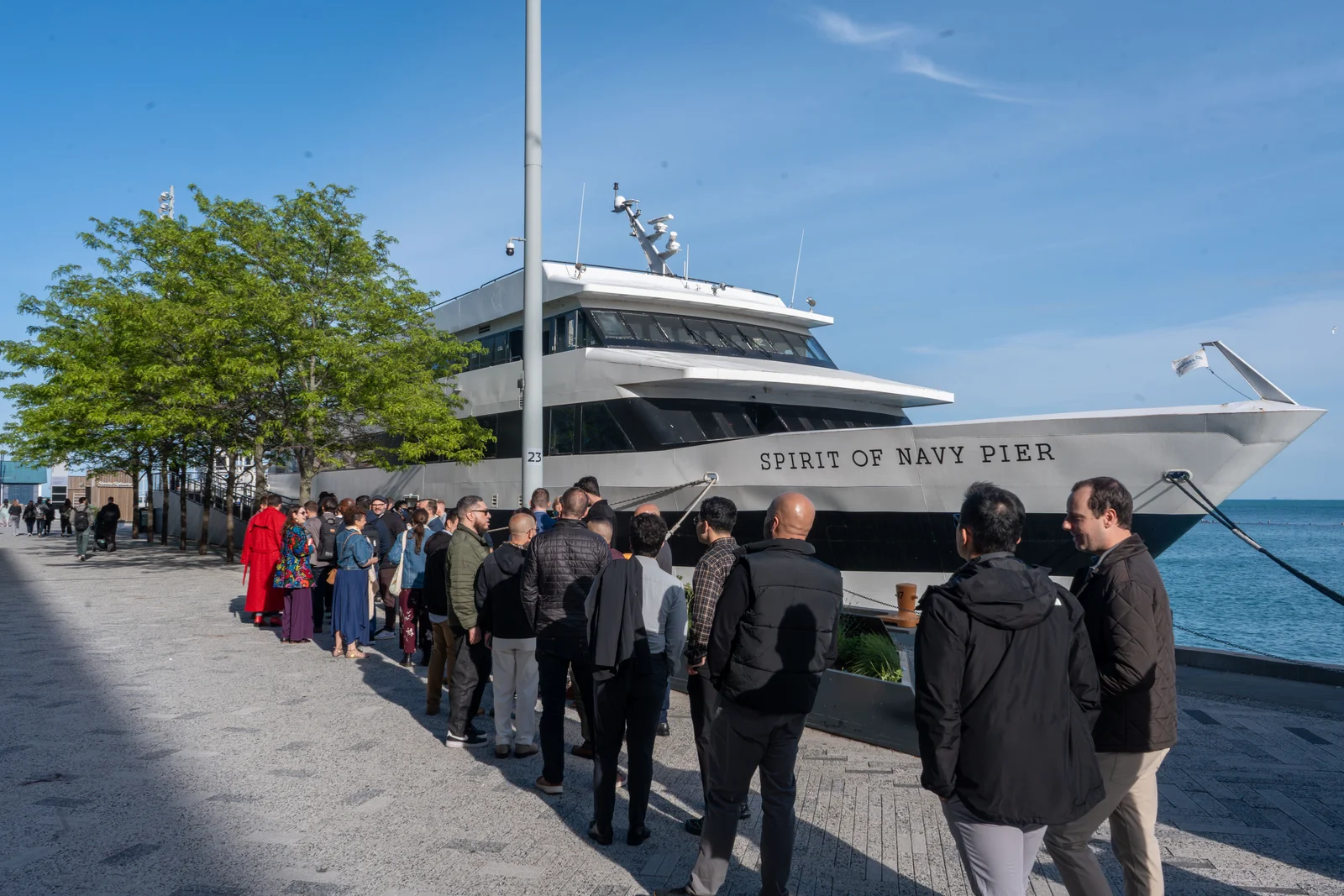 OutPro guests boarding the Spirit of Navy Pier under the Chicago skyline